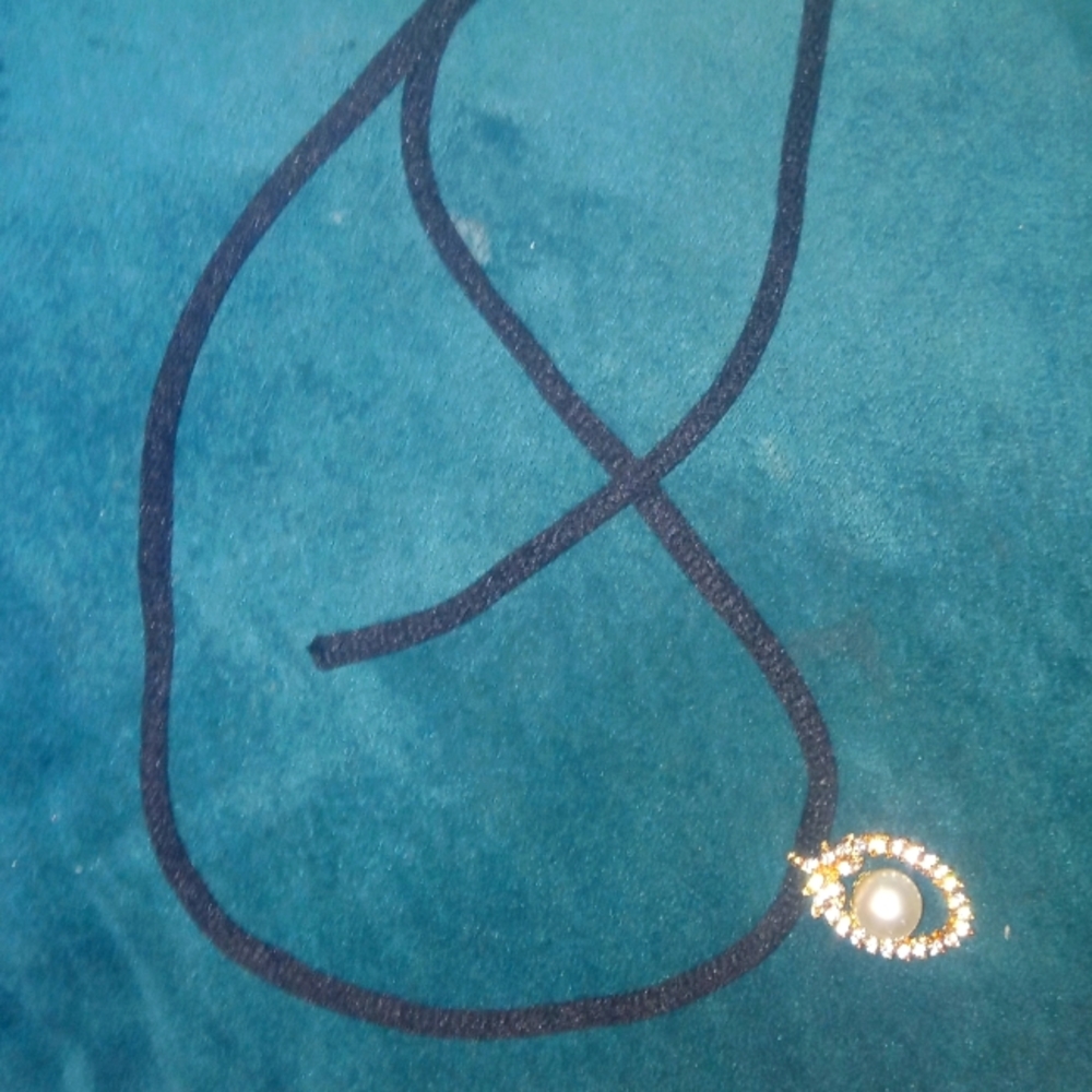 Necklace with faux pearl pendant